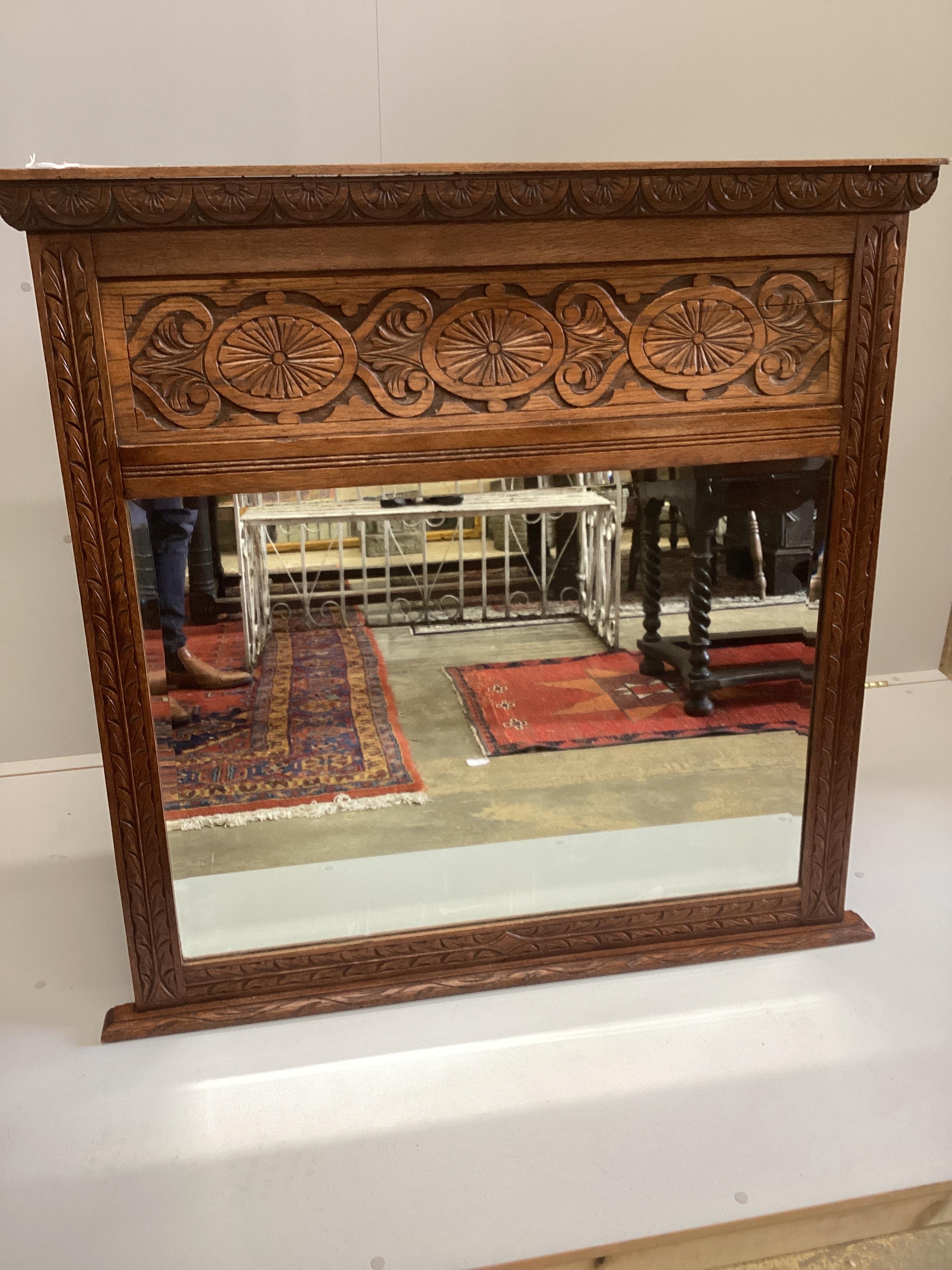A late 19th century carved oak overmantel mirror, width 112cm, height 112cm